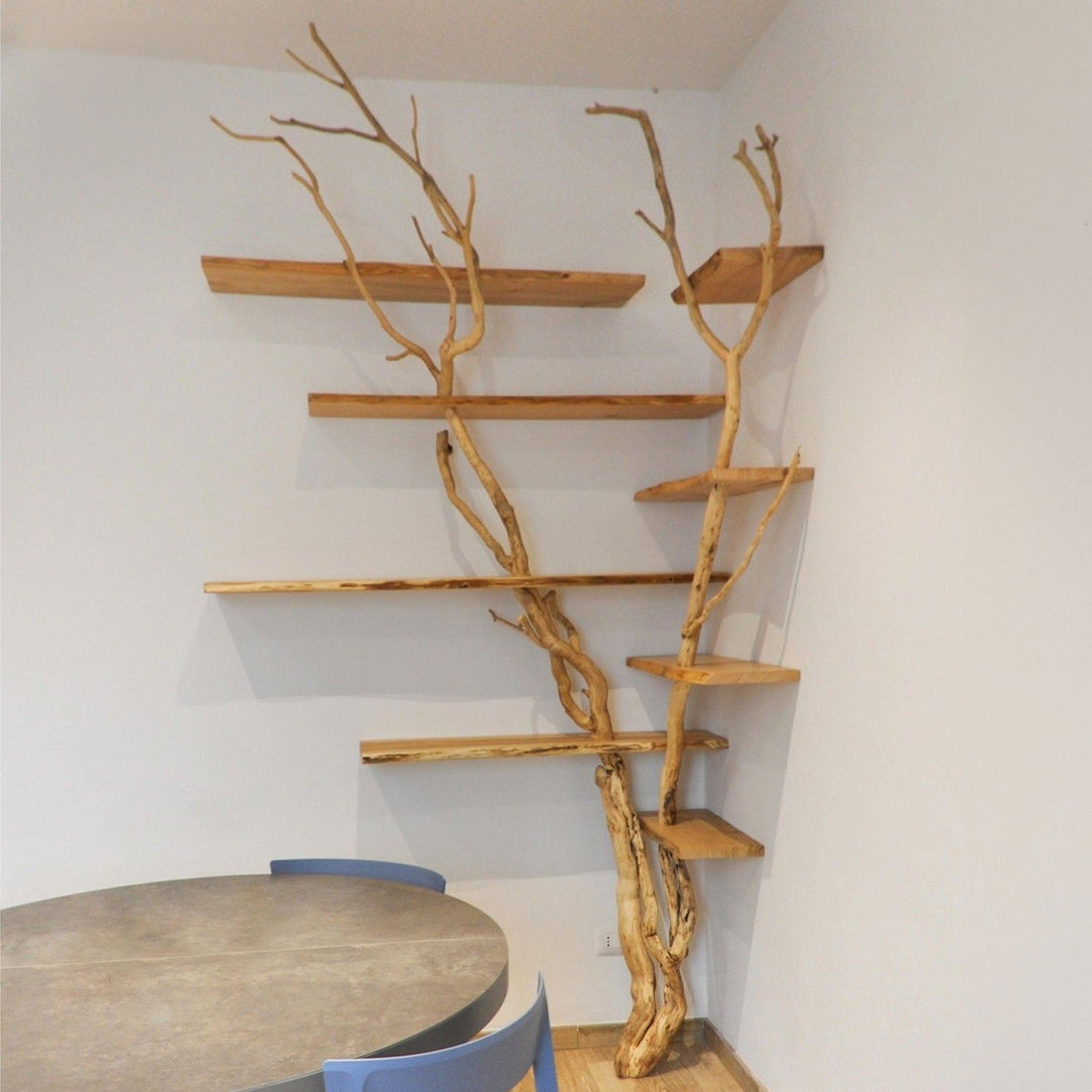 Floating Wood Bookshelves with Tree Branch Accents